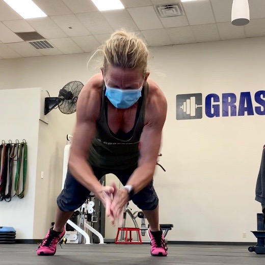 Woman performing clapping pushup