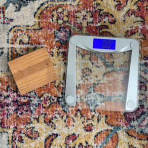 Home scale and piece of wood