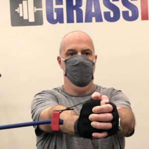 Man doing core exercise with resistance band
