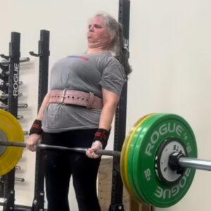 Middle Aged Woman performing Deadlift