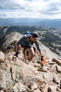Man climbing jagged rocks on mountain