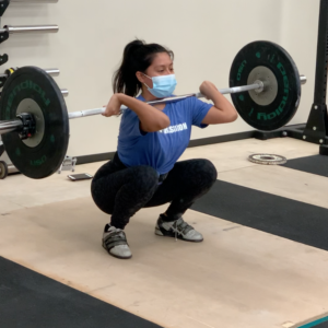 Woman performing a clean with 35kg