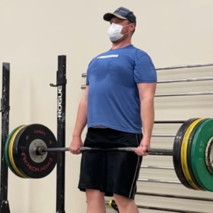 Man performing barbell deadlift