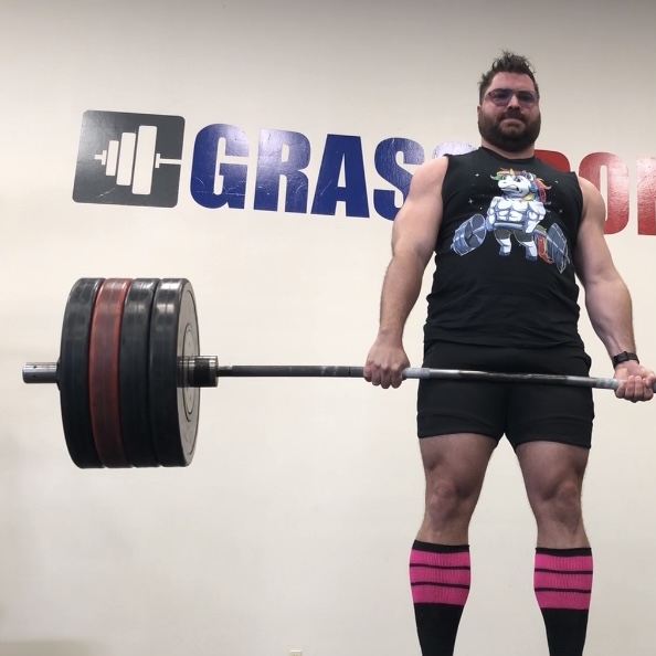 Man deadlifting 230kg