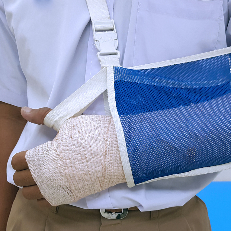 man with arm in cast and sling
